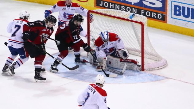 Vancouver Giants right wing Jared Dmitriw (22) shoots against the Spokane Chiefs