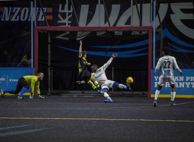 Milwaukee Wave midfielder Ricardinho Sobreira scores against the Kansas City Comets