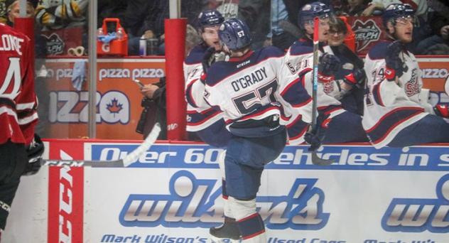 Reagan O'Grady and the Saginaw Spirit celebrate a goal