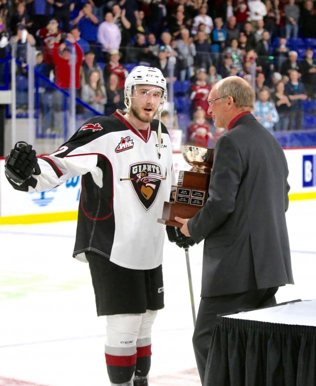 Vancouver Giants right wing Jared Dmitriw with the Western Conference Championship trophy