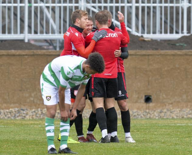 Cavalry FC celebrate a goal against Foothills USL in preseason action