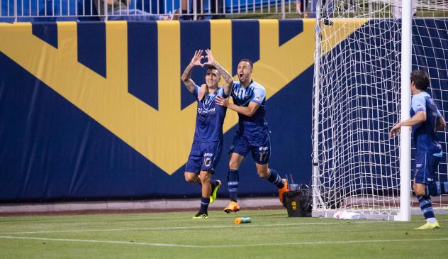 Sebastian Contreras and Jerome Kiesewetter of El Paso Locomotive FC celebrate Contreras's goal