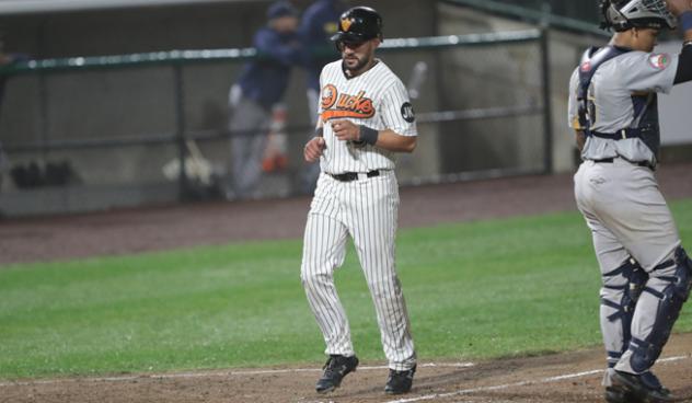 Rey Fuentes crosses home plate for the Long Island Ducks