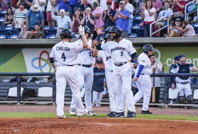 Tanner English of the Pensacola Blue Wahoos receives congratulations after his first inning grand slam