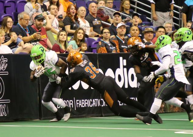 Phillip Henry of the Arizona Rattlers makes a tackle against the boards vs. the Nebraska Danger