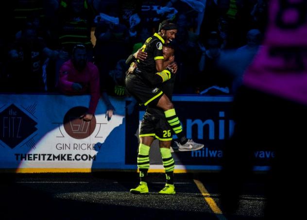 Milwaukee Wave forwards Max Ferdinand and Ian Bennett celebrate a goal against the Monterrey Flash