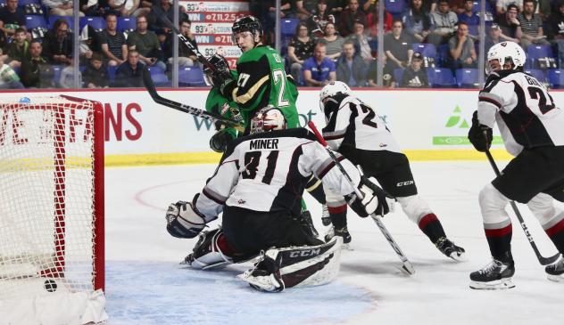 Vancouver Giants goaltender Trent Miner sees a shot slip past for a Prince Albert Raiders goal