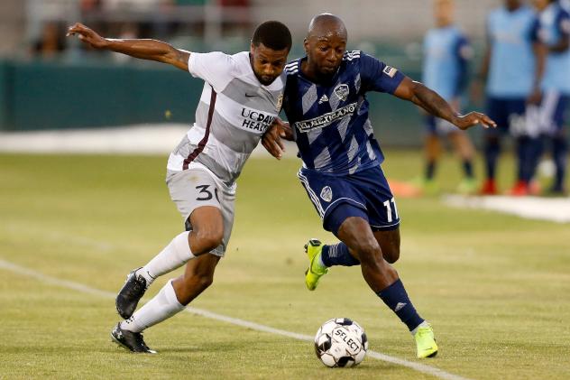 Sacramento Republic FC defender Jordan McCrary (left) against Fresno FC