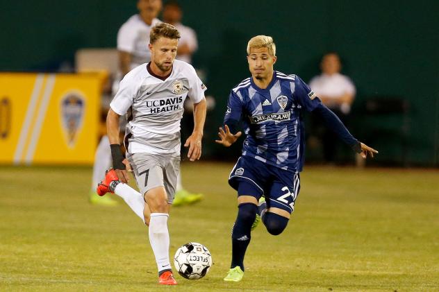 Sacramento Republic FC midfielder Hayden Partain (left) against Fresno FC