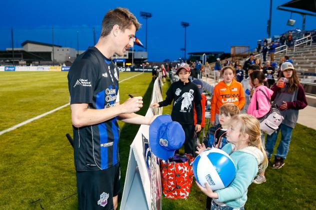 Colorado Springs Switchbacks FC sign autographs for young fans