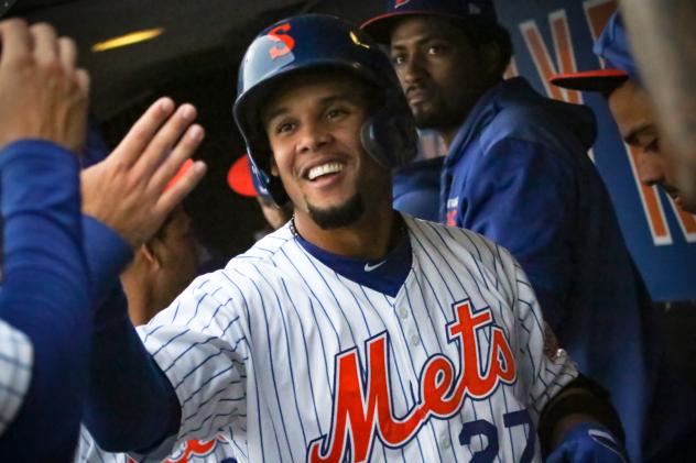 Carlos GÃ³mez celebrates with his Syracuse Mets teammates after hitting a three-run home run in Thursday's game