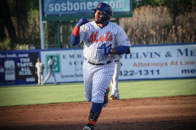 Rene Rivera of the Syracuse Mets rounds the bases after hitting his first of two home runs on Friday night