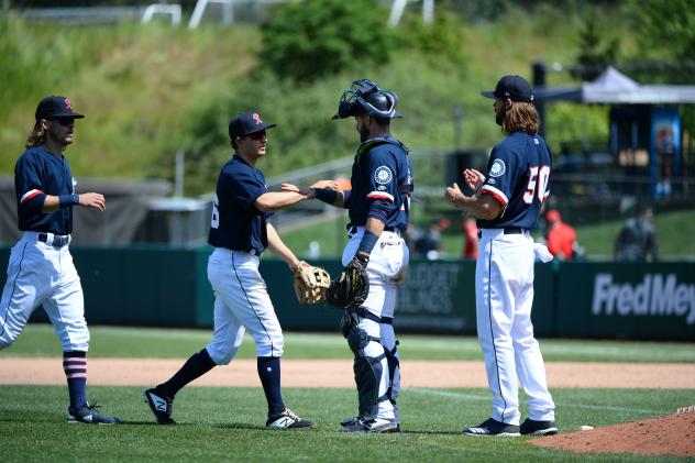 Tacoma Rainiers exchange congratulations following Sunday's win