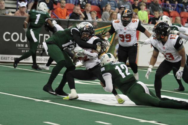 Green Bay Blizzard make a tackle against the Bismarck Bucks