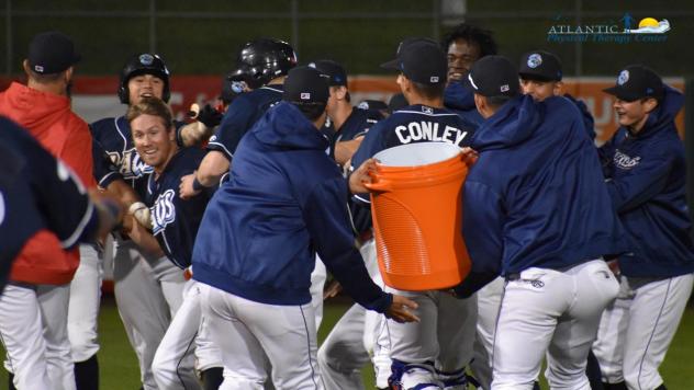 Lakewood BlueClaws prepare a Gatorade shower for Cole Stobbe