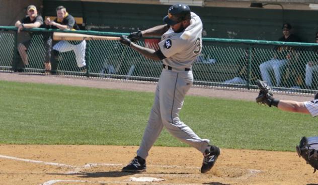 David Washington of the Long Island Ducks connects with a pitch