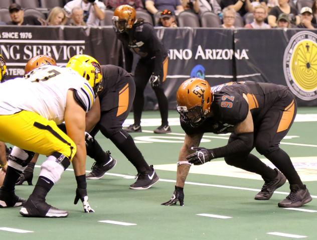Nikolaus D'Avanzo of the Arizona Rattlers (right) lines up against the Tucson Sugar Skulls