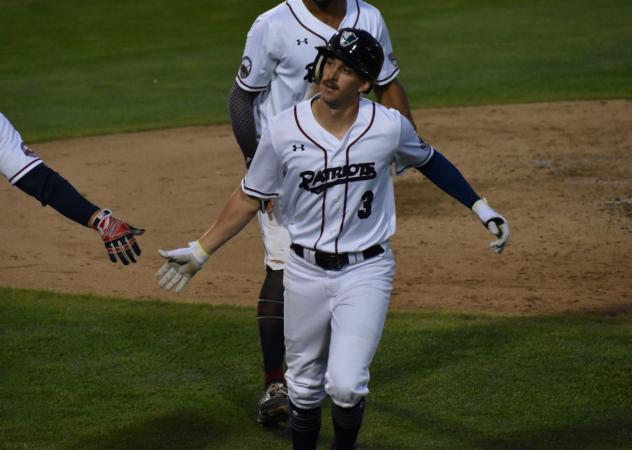 Mike Fransoso of the Somerset Patriots receives congratulations after his home run