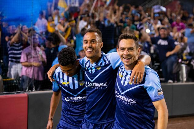 Jerome Kiesewetter of El Paso Locomotive FC (center) walks off the field with his teammates