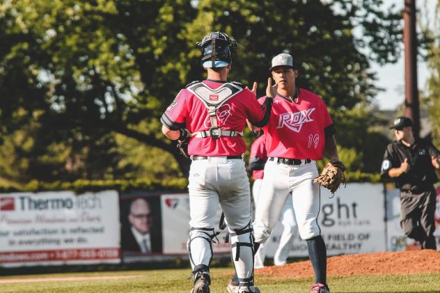 Cam Kline of the St. Cloud Rox receives congratulations from his catcher