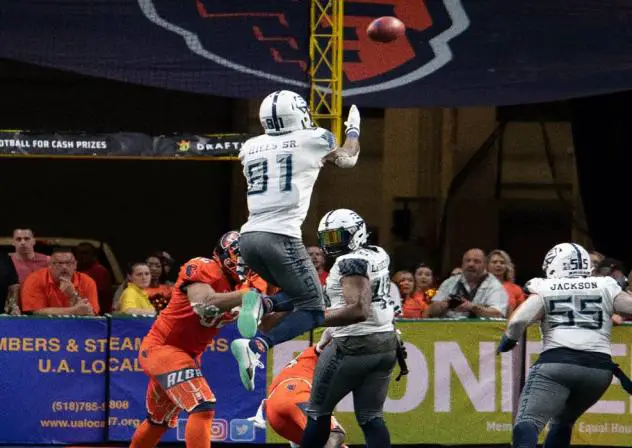 Baltimore Brigade wide receiver Joe Hills leaps high for a ball against the Albany Empire