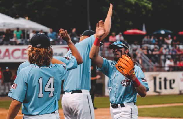 St. Cloud Rox exchange high fives after a win