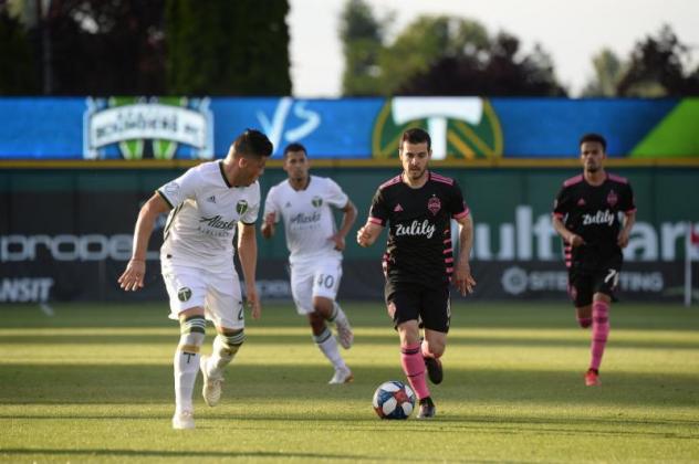 Victor Rodriguez of Seattle Sounders FC with possession vs. the Portland Timbers