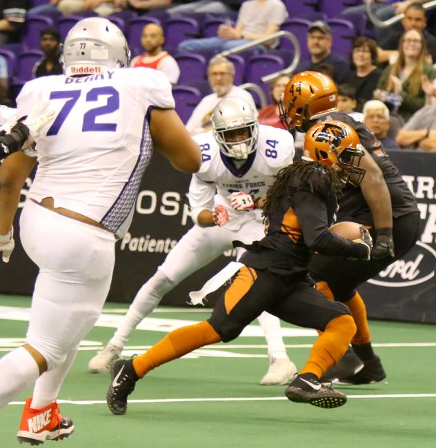 Arizona Rattlers carry the ball against the San Diego Strike Force