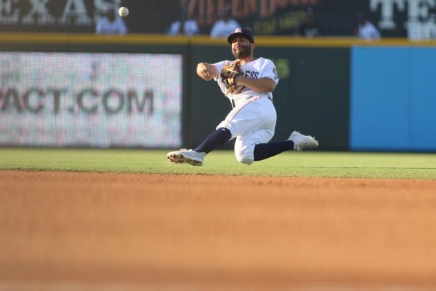 2B Jose Altuve makes a throw while falling for the Round Rock Express