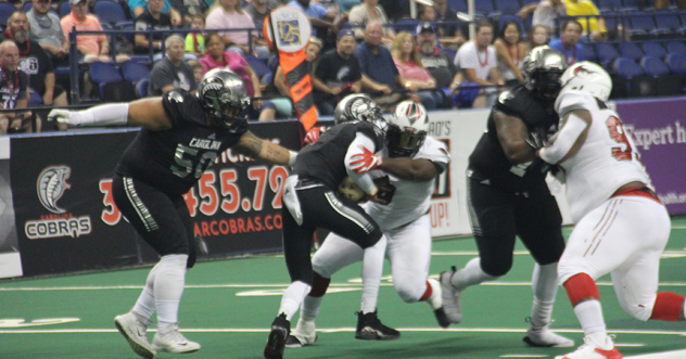 Jacksonville Sharks defense converges on the Carolina Cobras