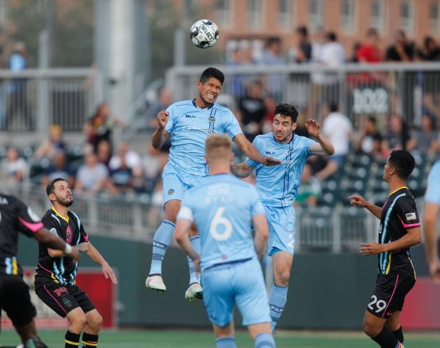 Bryam Rebellon (left), Drew Beckie(right) and Richie_Ryan (front) of El Paso Locomotive FC vs. Las Vegas Lights FC
