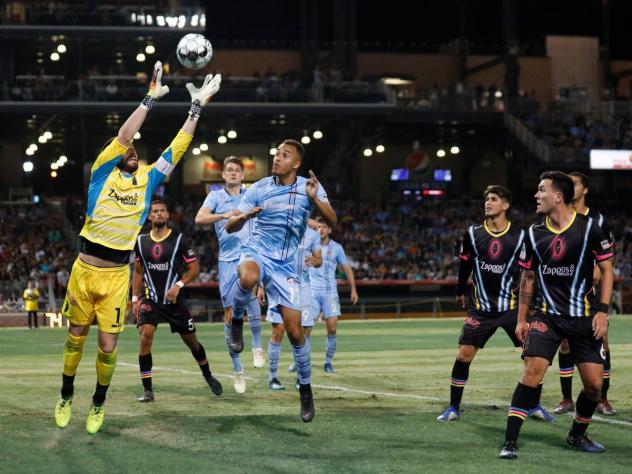 Las Vegas Lights FC goalkeeper Thomas Olsen corrals the ball against El Paso Locomotive FC