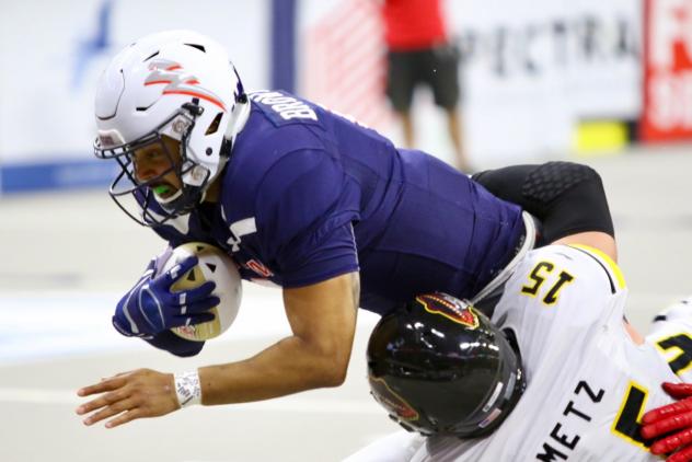 Sioux Falls Storm quarterback Lorenzo Brown dives for yardage against the Tucson Sugar Skulls