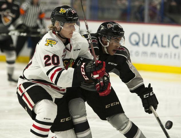 Vancouver Giants centre Justin Sourdif (right) against the Portland Winterhawks