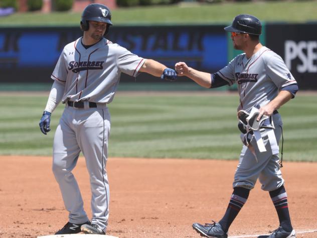 Dario Pizzano of the Somerset Patriots receives a fist bump