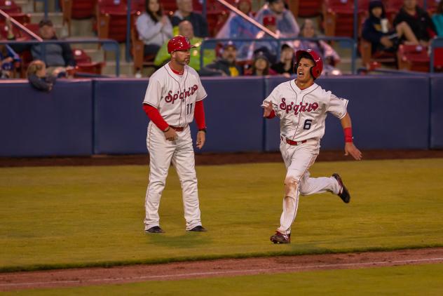 Spokane Indians second baseman Kenen Irizarry digs for home