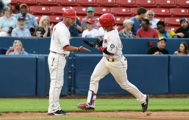 Spokane Indians catcher David Garcia rounds the bases