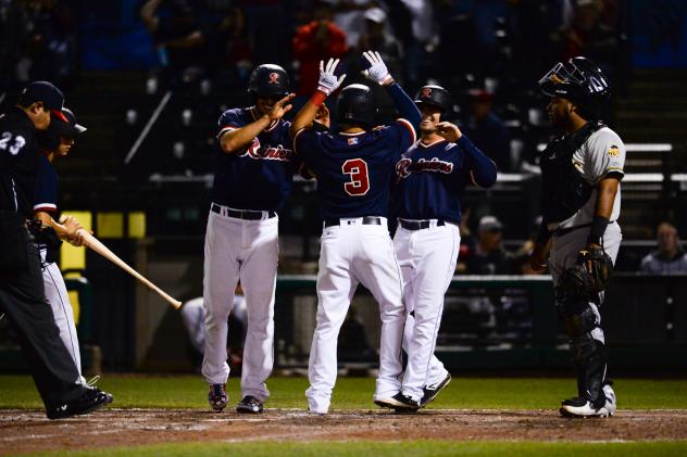 Chris Mariscal celebrates with his Tacoma Rainiers teammates