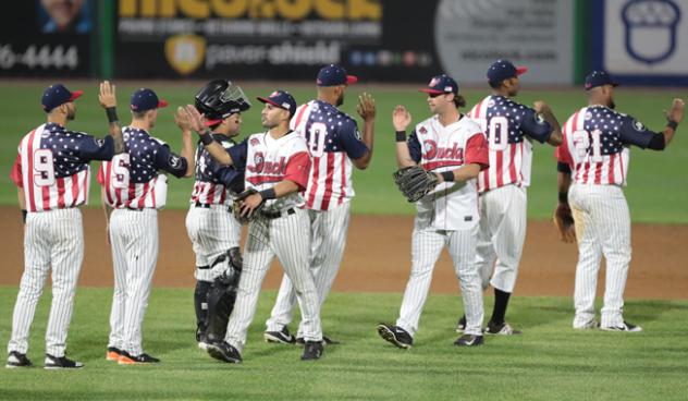 Long Island Ducks celebrate in their Fourth of July jerseys