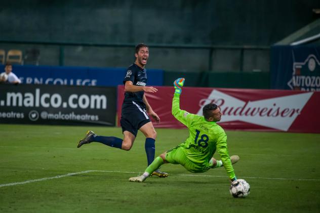 Elliot Collier of Memphis 901 sneaks a ball past Hartford Athletic