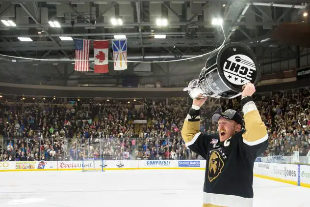 Newfoundland Growlers captain James Melindy hoists the Kelly Cup