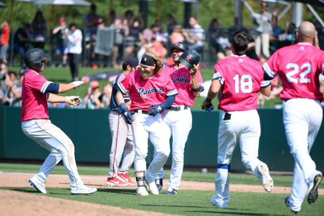 Jake Fraley is mobbed by his Tacoma Rainiers teammates following his game-winning hit
