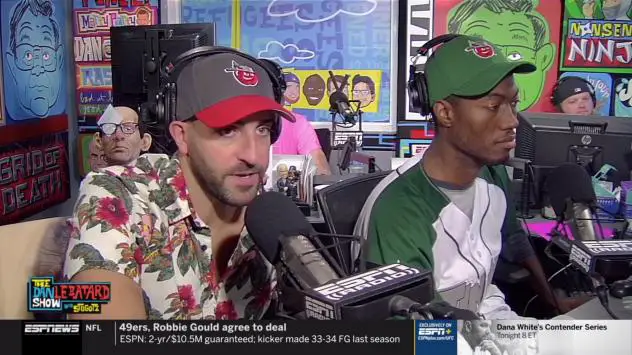 Mike Ryan (left) wearing a Fort Wayne TinCaps hat while on ESPNews