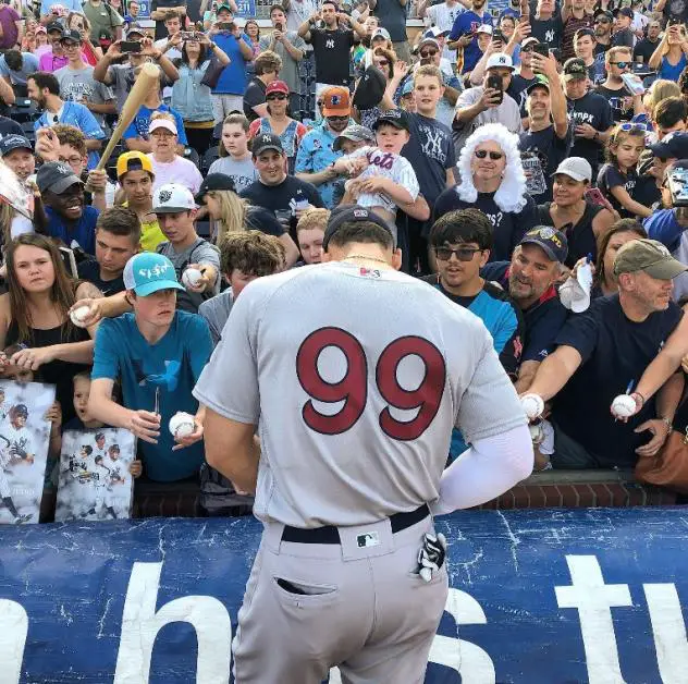 Aaron Judge of the New York Yankees, rehabbing with the Scranton/Wilkes-Barre RailRiders, signs autographs in Durham
