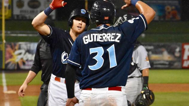Abraham Gutierrez of the Lakewood BlueClaws gives a high five
