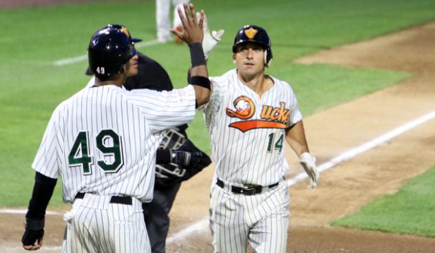 T.J. Rivera and D'Arby Myers exchange a high five