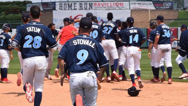 Lakewood BlueClaws mob Ben Pelletier after his game-winning hit