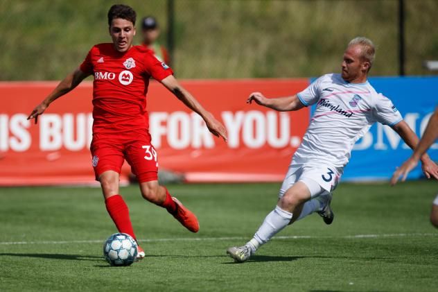 Forward Madison FC defender Eric Leonard (right) vs. Toronto FC II