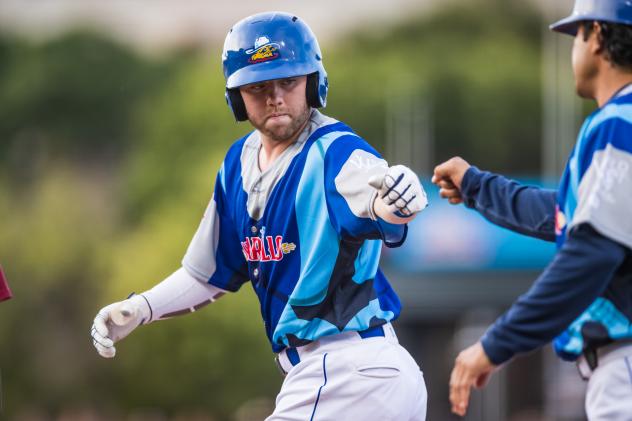 Amarillo Sod Poodles infielder Owen Miller gets a fist bump after another hit