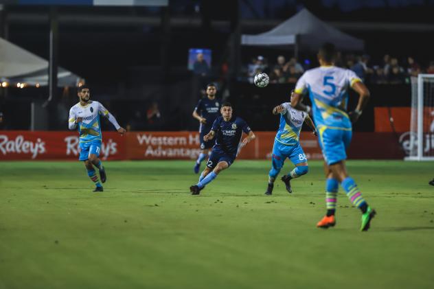 Sacramento Republic FC midfielder Drew Skundrich (center) against Las Vegas Lights FC